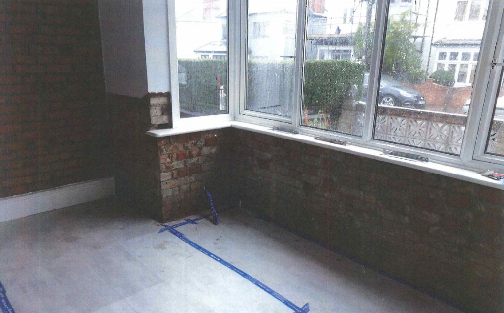 Floor Protection laid and wall plaster removed ready for Damp Proof Course Injection